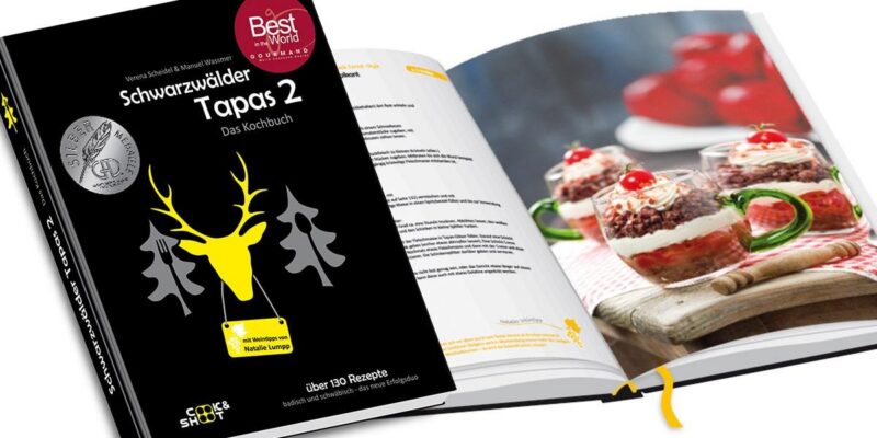 Kochbuch 'Schwarzwälder Tapas 2' mit Rezepten und Bildern von Speisen.