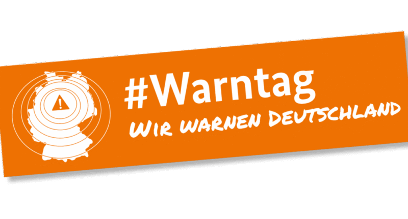 Banner zum Warntag mit Warnsymbol und Text #Warntag.